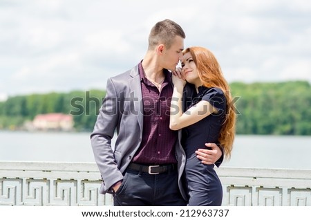 couple kiss in love, sweet romance by the lake