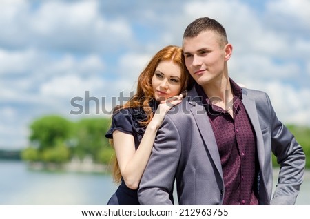 couple kiss in love, sweet romance by the lake