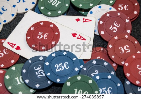 pair of aces with chips for poker