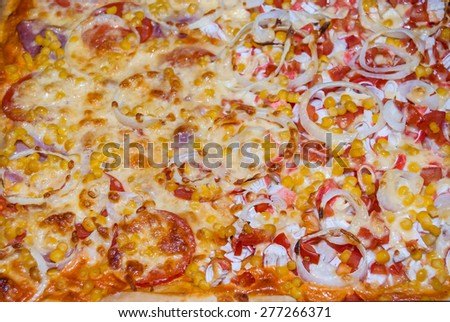 pizza with tomatoes, chicken, corn, crab sticks and cheese