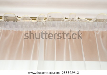 Close up elegance curtain. part of draperies at a window. Decoration background