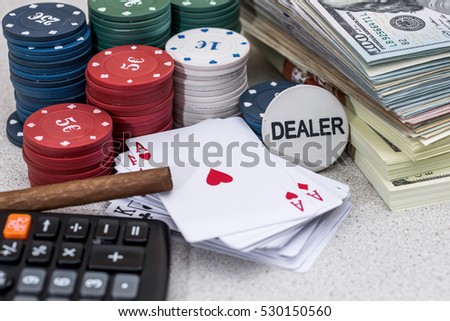 poker chips and play card with sigar and money