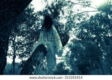 Guardian of the Forest, Mysterious Woman in White Dress in the Forest,Scary Woman in the Wood,Horror Background For Halloween Concept and Book Cover Ideas