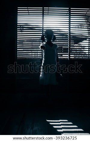 Portrait of scary girl pointing hand at cameras,Ghost girl hiding from the dark,Horror background for halloween