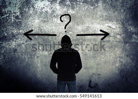 Lost,Man wearing hoodie looking to the wall with decision making concept and ideas