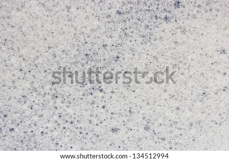 A closeup macro texture of soap sud bubbles