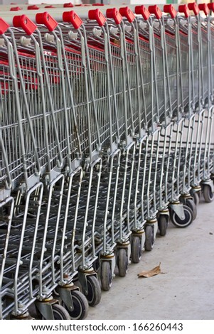 Row of shopping carts at supermarket entrance