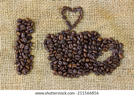 I love coffee symbols made of coffee beans on sack background