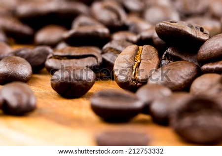 Coffee on wooden background Fresh coffee beans on wood ,ready to brew delicious coffee