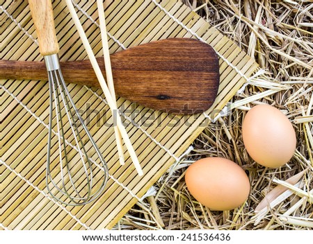 Kitchenware and eggs on straw(Emulsifying and Wood Spatula)