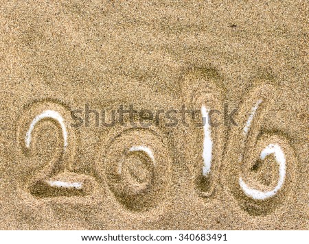 Beach Sand Texture and Background with 2016 on white