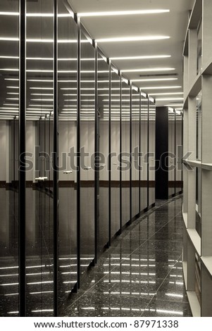 Mirror doors in office building corridor