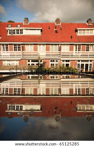 Dutch Houses in a row with reflection on foreground