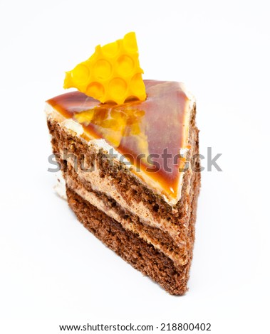 Piece of honey cake isolated on a white background