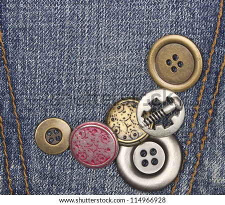 metal buttons on jeans background
