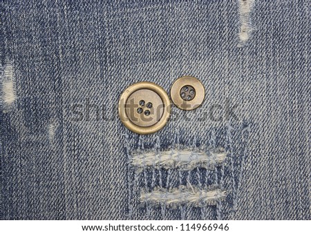 metal buttons on jeans background