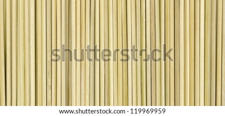 Straw background with crisp discrete vertical stripes