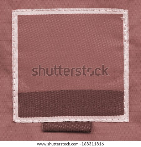 brown textile label  on brown fabric background