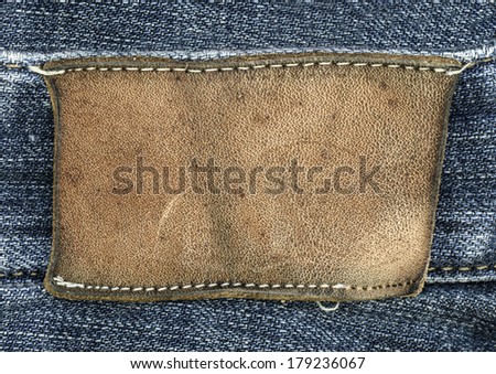 blank  leather label on jeans background.Useful for Your text