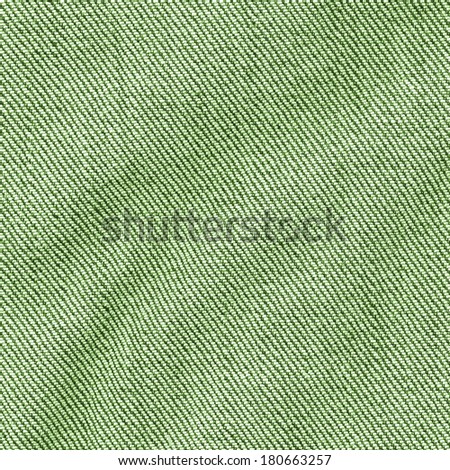 crumpled green jeans fabric closeup