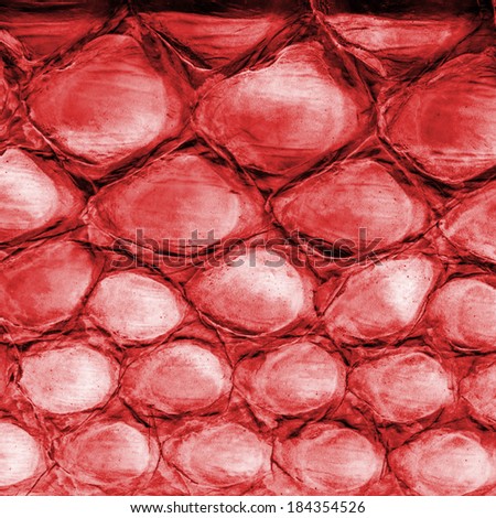 fragment of dressed red reptile skin closeup
