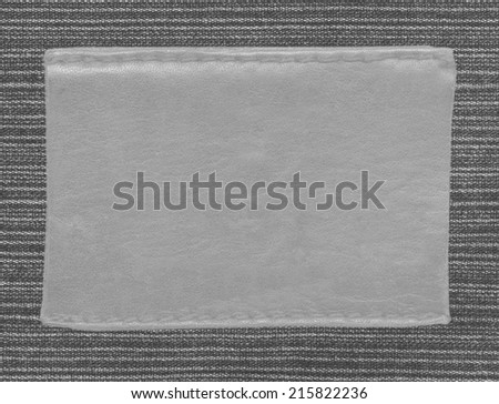gray leather blank label on blackt jeans background