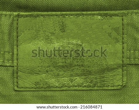 green label on green denim background