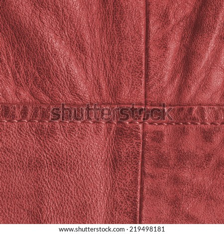 fragment of red leather coat closeup