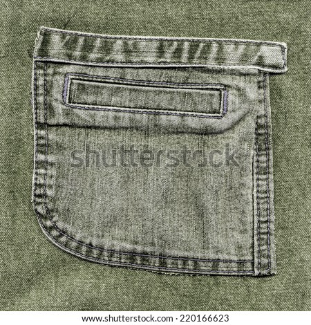 pocket  on  gray-green jeans background