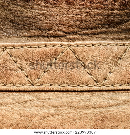 fragment of light brown leather coat closeup