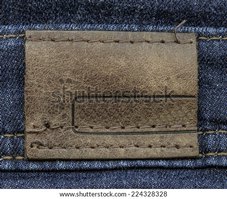 brown leather label on denim background