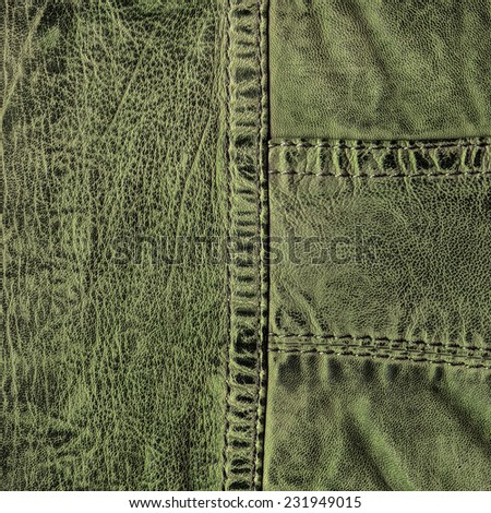 green leather texture, seams.Fragment of leather clothing accessories