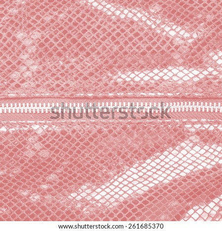 pale red artificial snake skin texture closeup, zipper (fragment of female handbag imitation snakeskin)