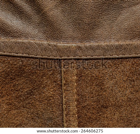 brown background of two kinds of leather, seams, stitches