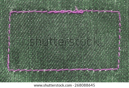 green jeans texture, seams in shape of frame