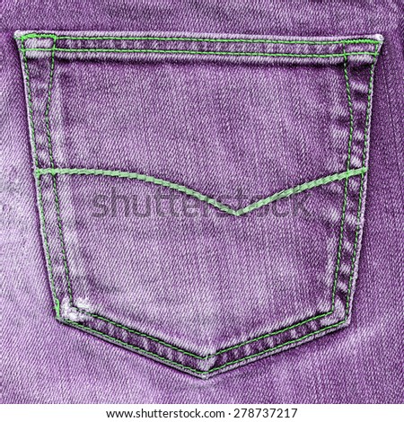 violet jeans pocket closeup on violet jeans background