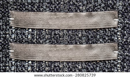 brown textile labels on gray textile background, blank labels for your text