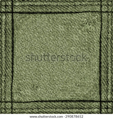 green jeans background, seams in shape of the frame