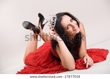 beautiful woman in a red dress with crown
