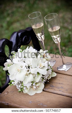 stock photo Wedding bouquet and glasses of champagne