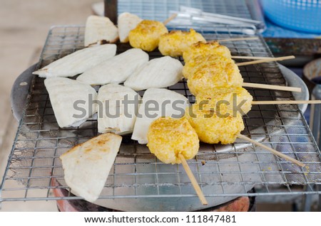 sticky rice grill on a charcoal. l(Thai tradition food sticky rice grill)