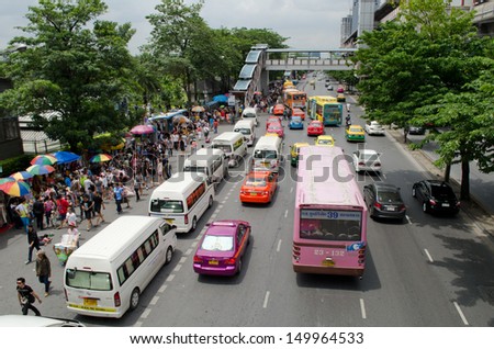 BANGKOK, THAILAND - AUGUST 04: cowds of people waiting for buses and taxis outside chatuchak market on August 04, 2013 in Bangkok. Chatuchak weekend market is the largest in Thailand.