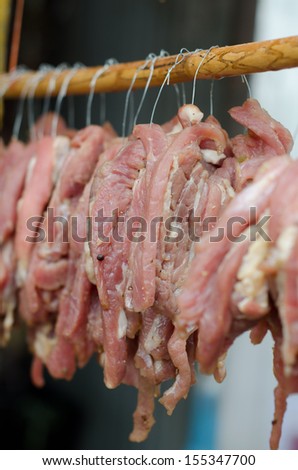 Sun dried beef on the wooden row