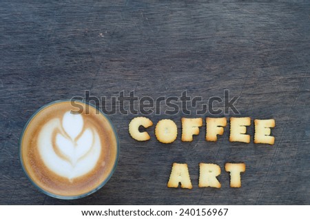 A cup of latte art and alphabet 
