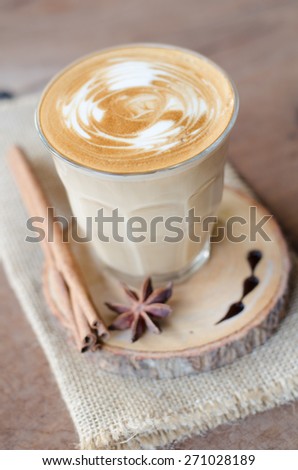 a glass of hot coffee on wooden table, vintage coffee