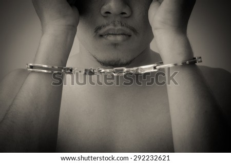 Young Man in Handcuffs, black and white image