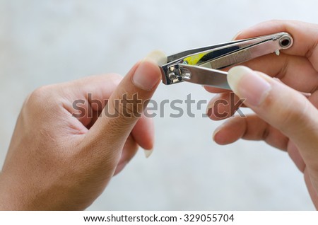 One man cutting hand nails