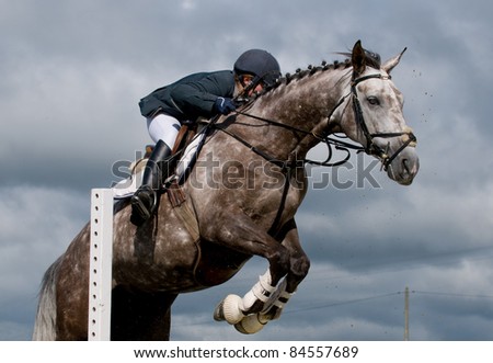 man and horse at jumping
