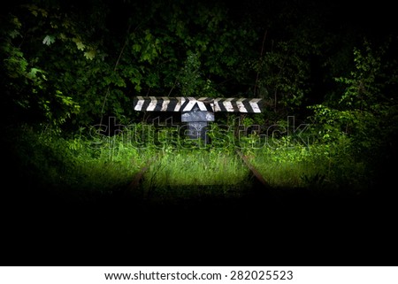 Dead end of the old abandoned railway line at night