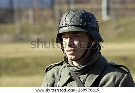 POZNAN, POLAND - MARCH 23, 2014: Re-enactment of the battle of the World War II. Anniversary of the liberation of the city of Poznan. In the picture one of the actors.